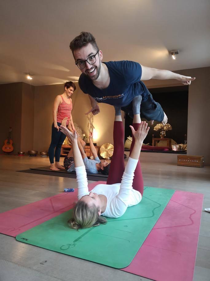 Syd flying a bird position in acroyoga